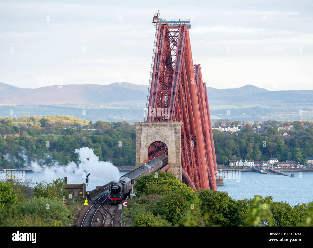 The Flying Scotsman steam train arriving at North Queensferry station after crossing the Forth Rail Bridge on a trip to Fife, Stock Photo