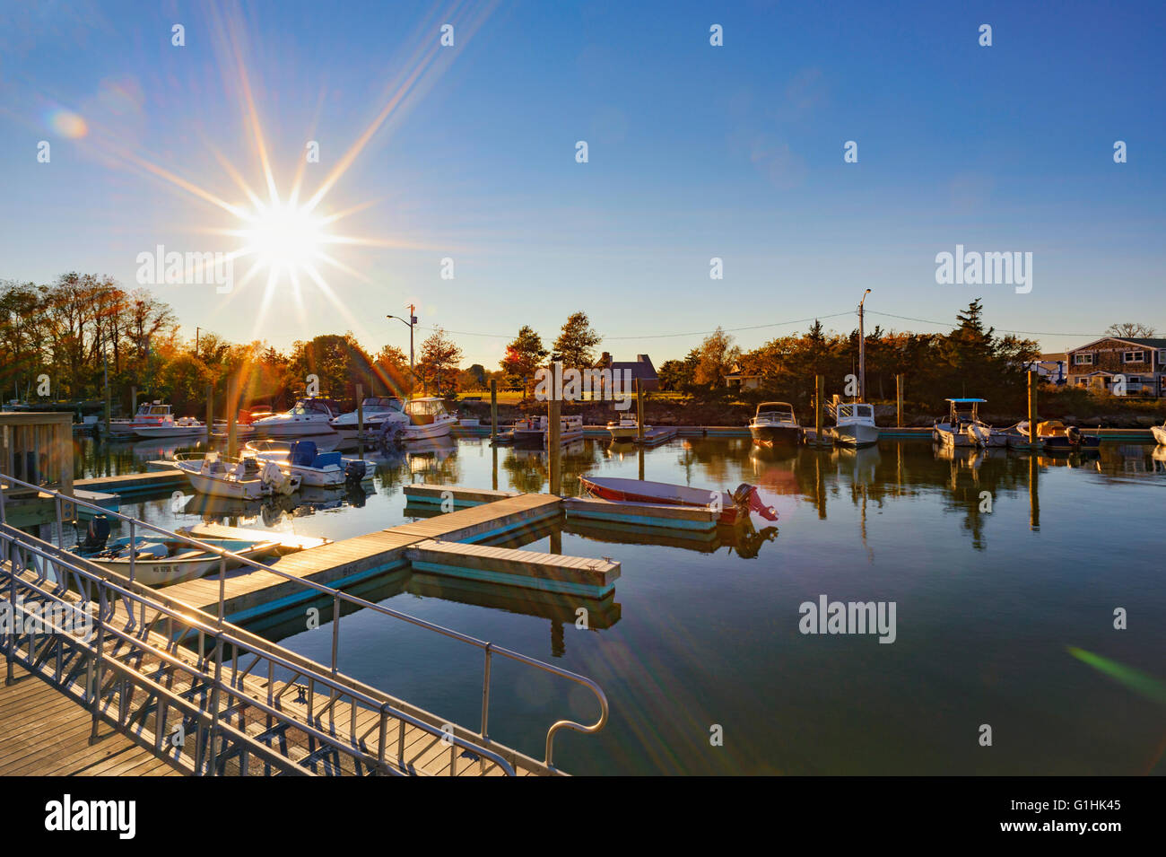 Millway Marina, Barnstable, Cape Cod, Massachusetts in the fall autumn with sunburst wooden boats, clear blue sky, copy space. Stock Photo
