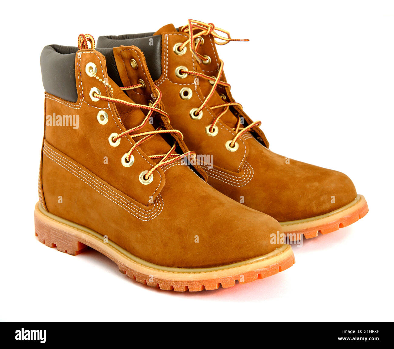 Brown lady's boots with shoelace on white background. Stock Photo