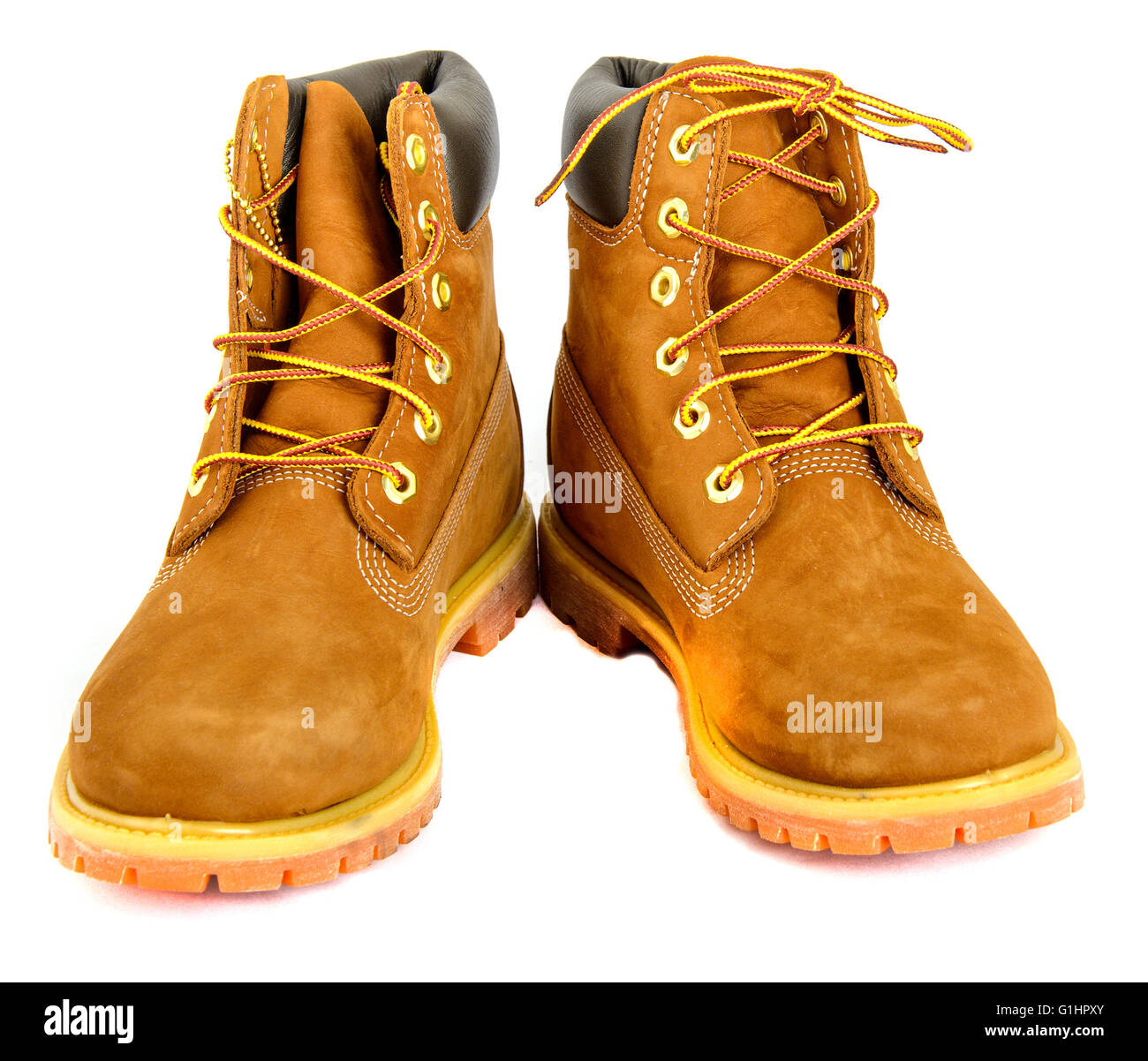 Brown lady's boots with shoelace on white background. Stock Photo