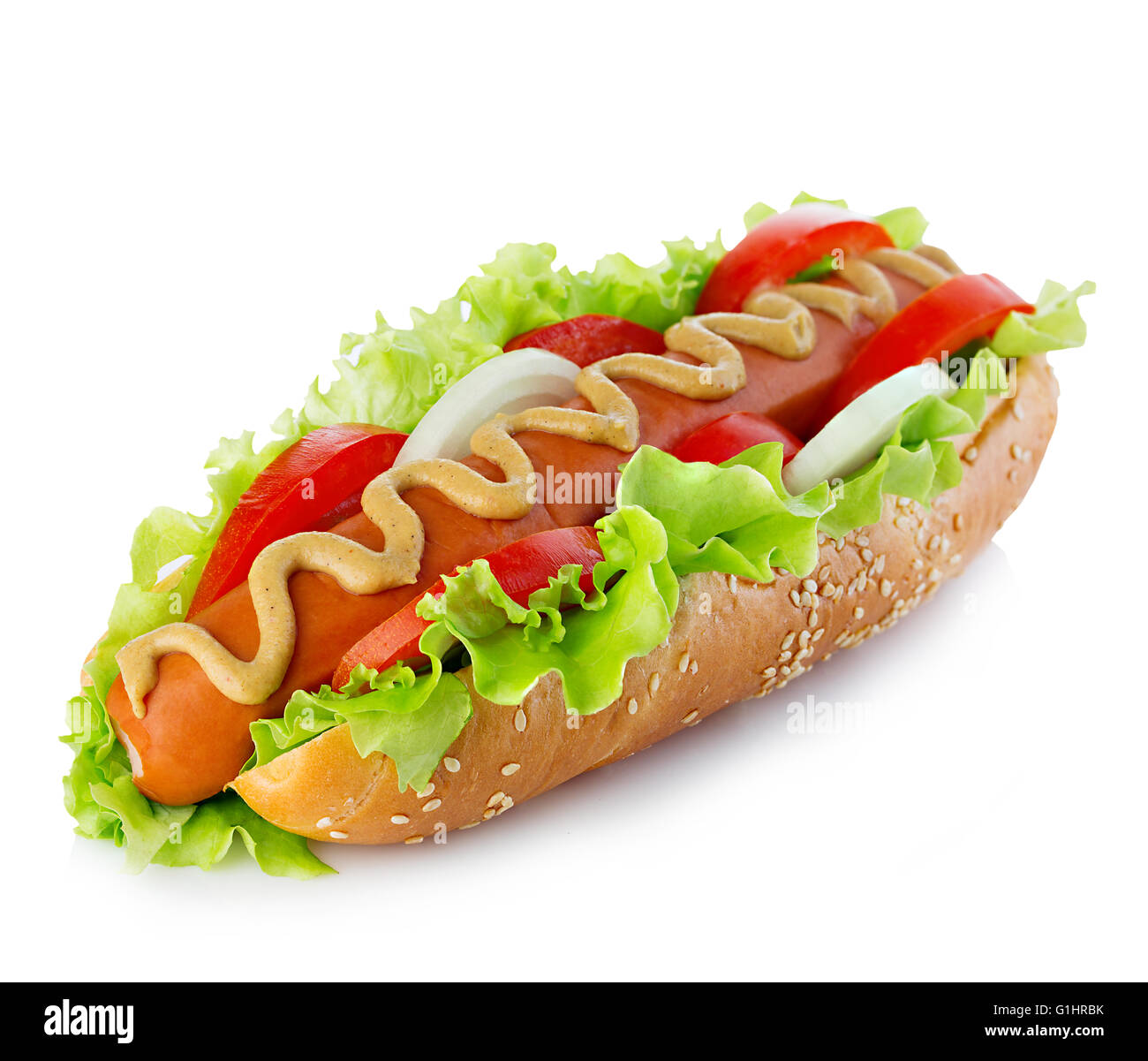 American style hot dog with lettuce, onion and tomato closeup on white