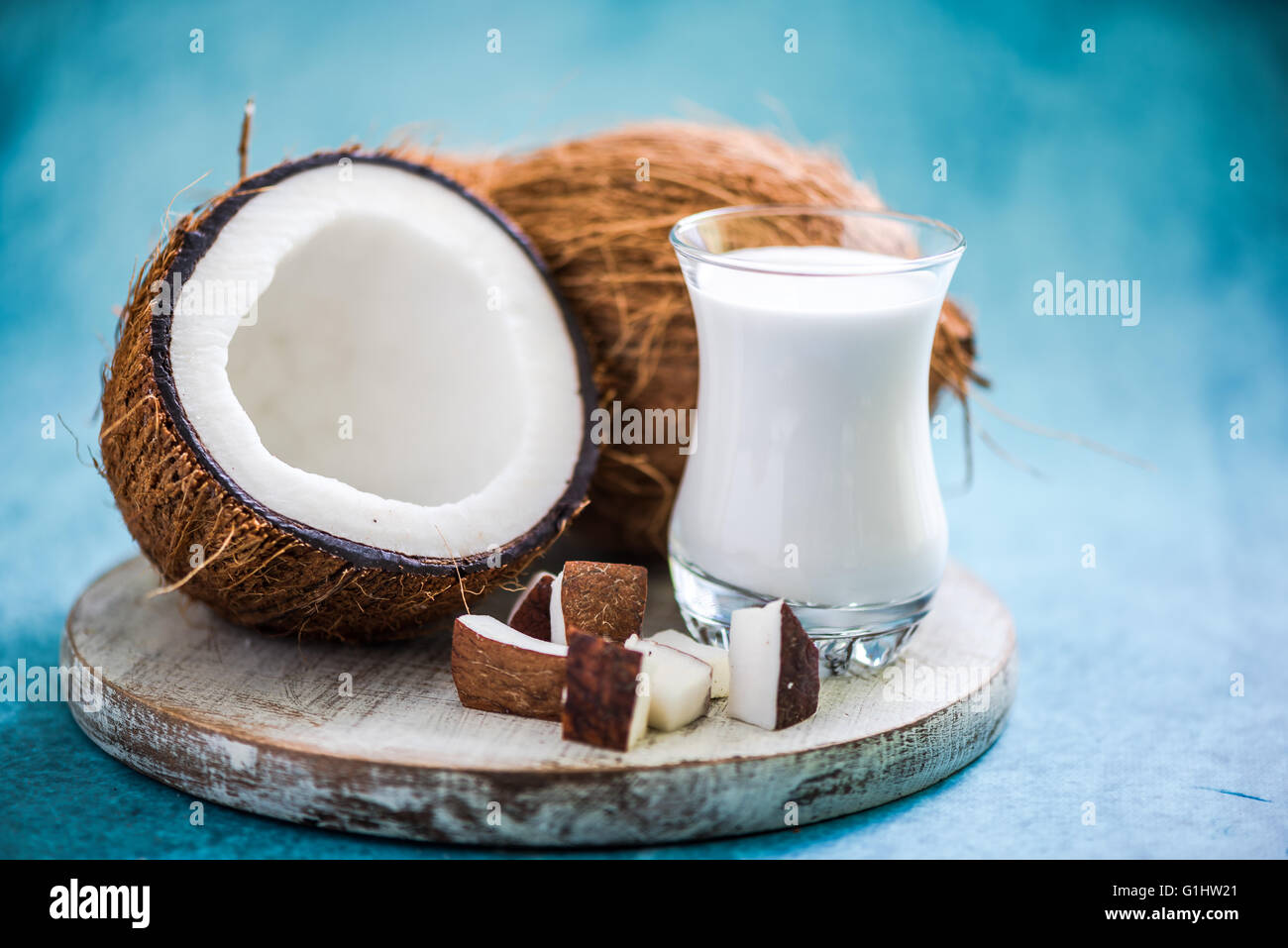 fresh and healthy coconut milk with whole nut and pieces Stock Photo