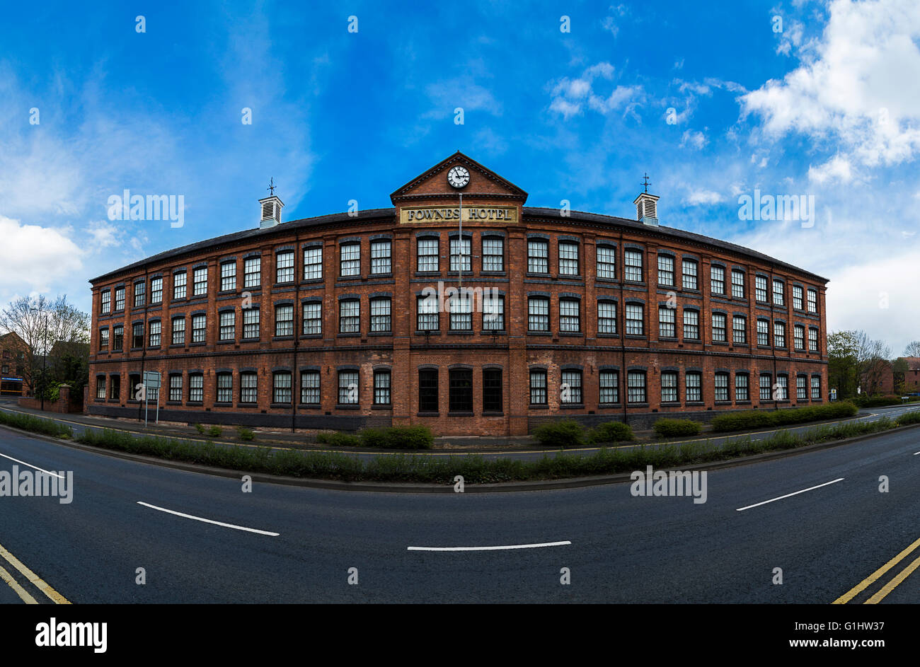 Panoramic photo of large hotel building against blue sky Stock Photo