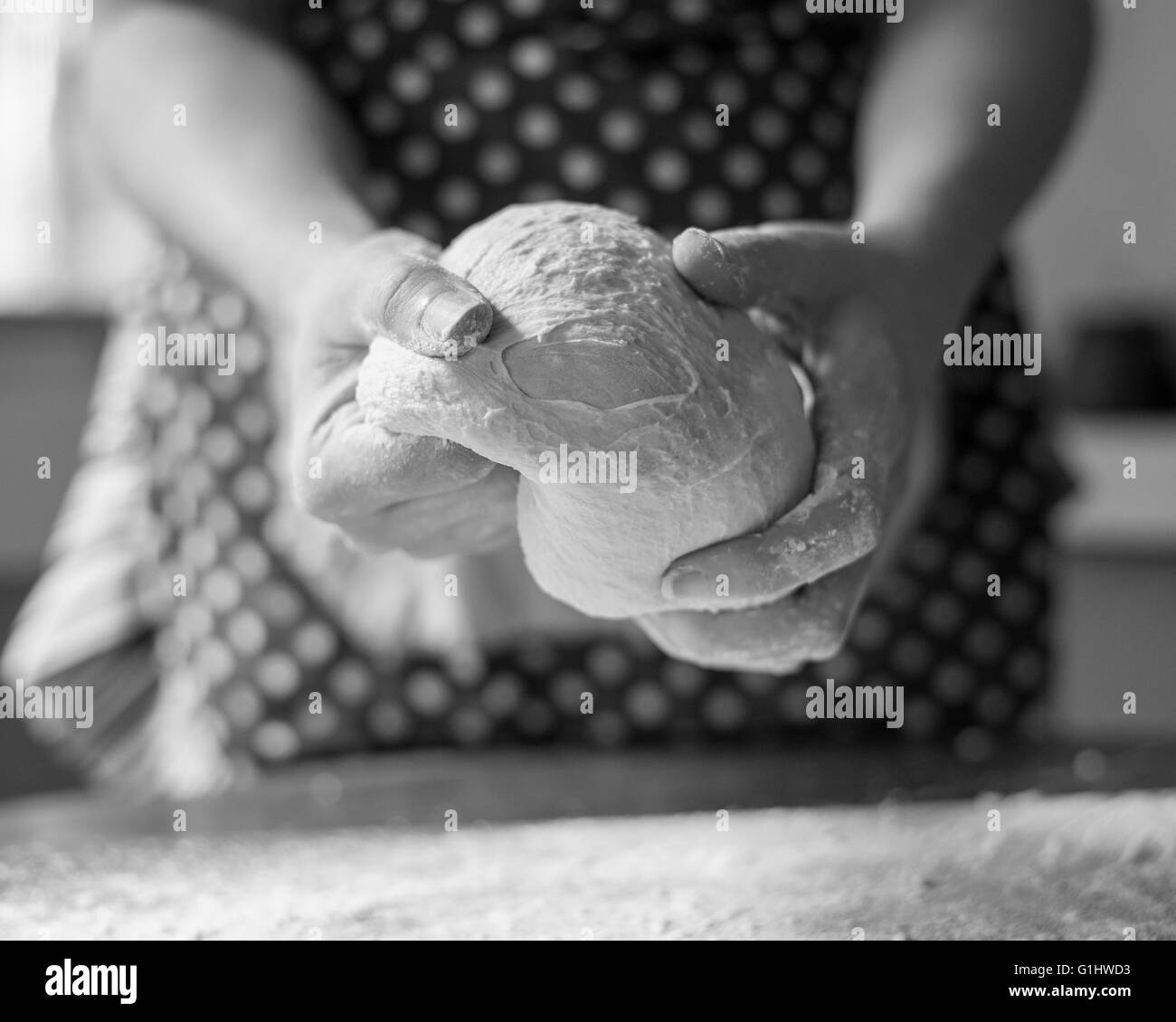 A woman kneads bread dough in her home kitchen Stock Photo - Alamy