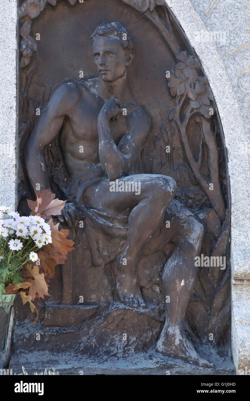 Mourning naked man depicted in a tombstone at the Monumental Cemetery (Cimitero Monumentale di Milano) in Milan, Lombardy, Italy. Stock Photo