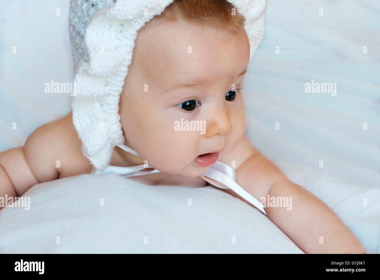 innocent baby on a white background Stock Photo