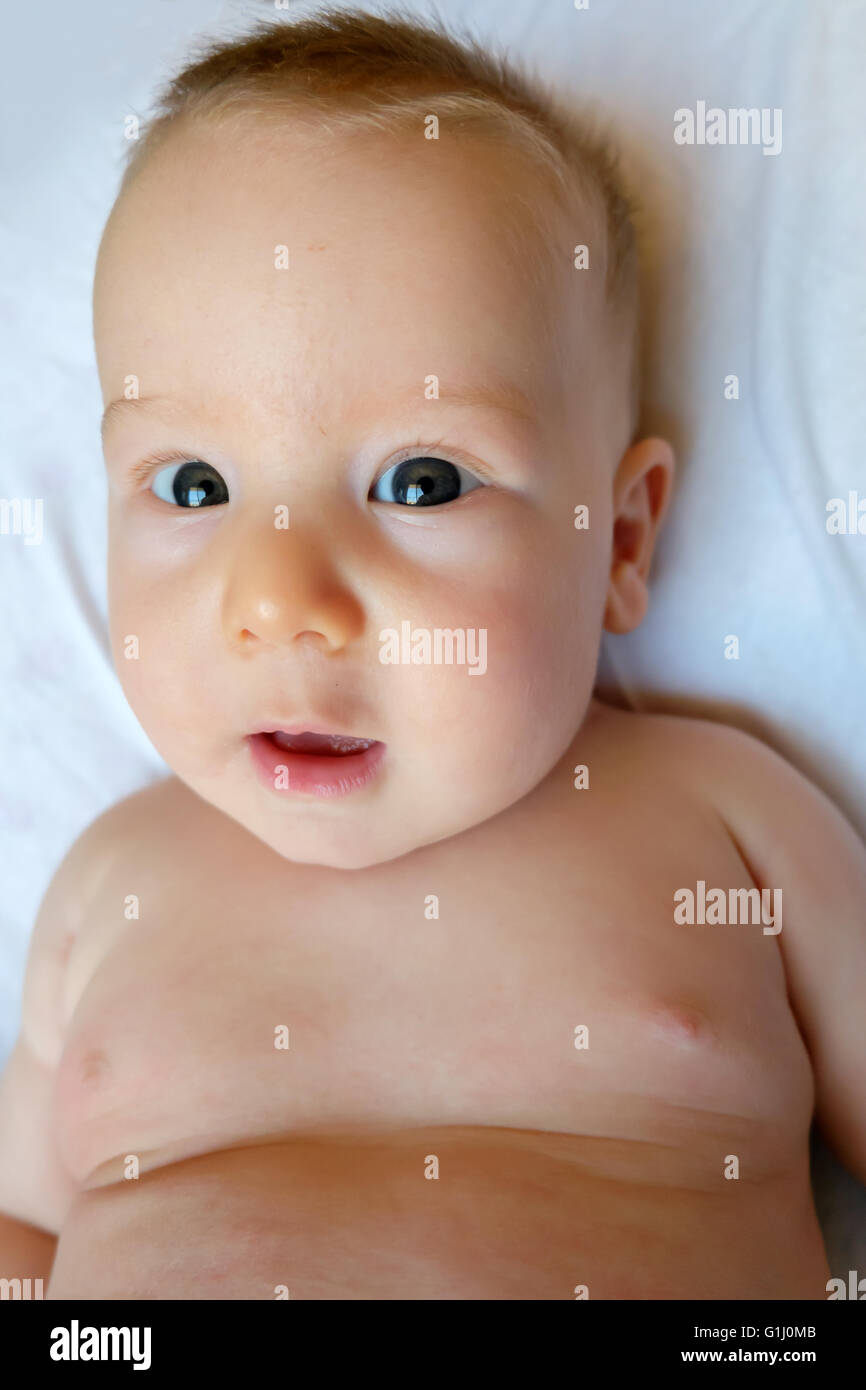 innocent baby on a white background Stock Photo