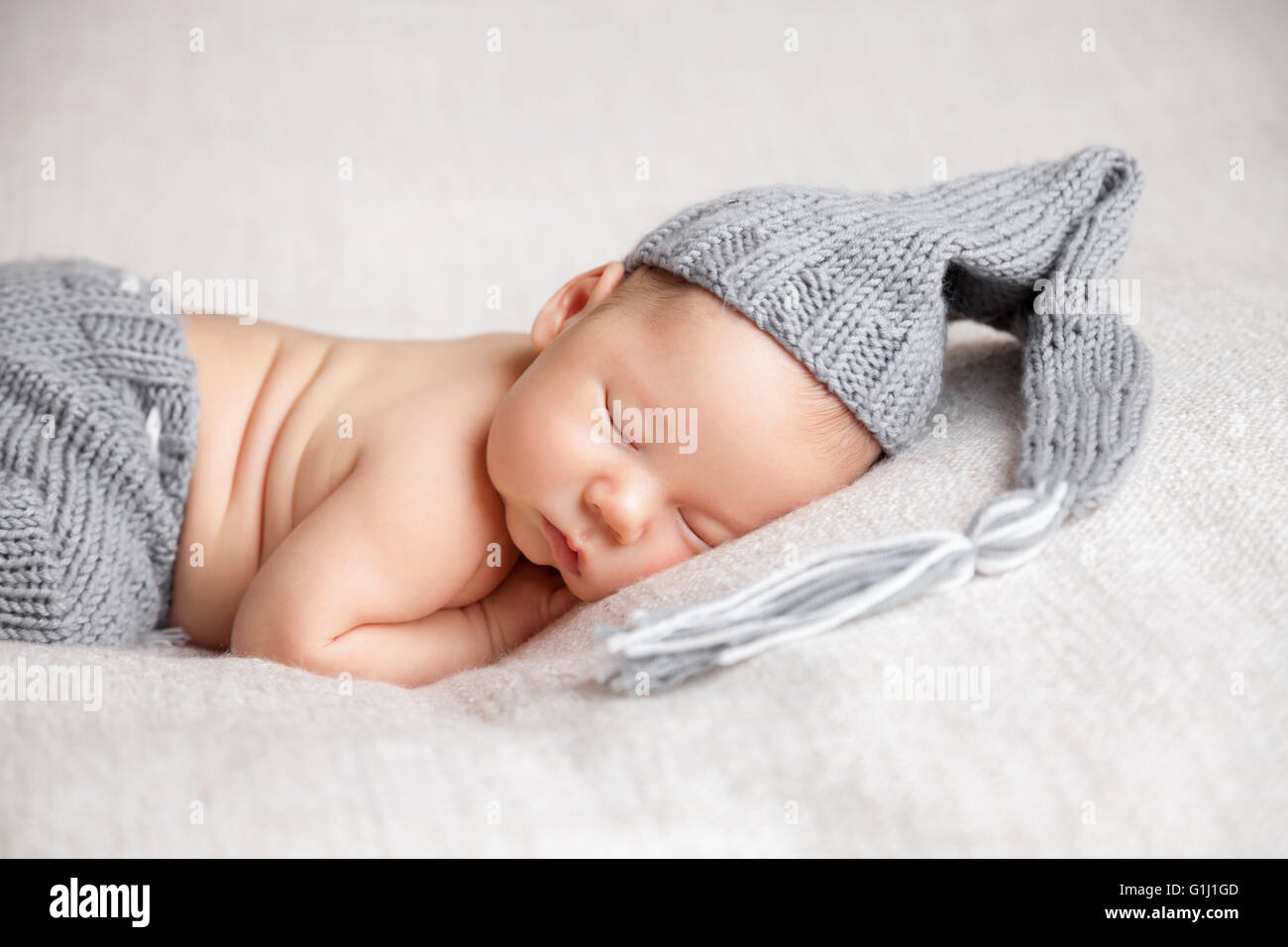 Beautiful newborn baby sleeping on a blanket Stock Photo