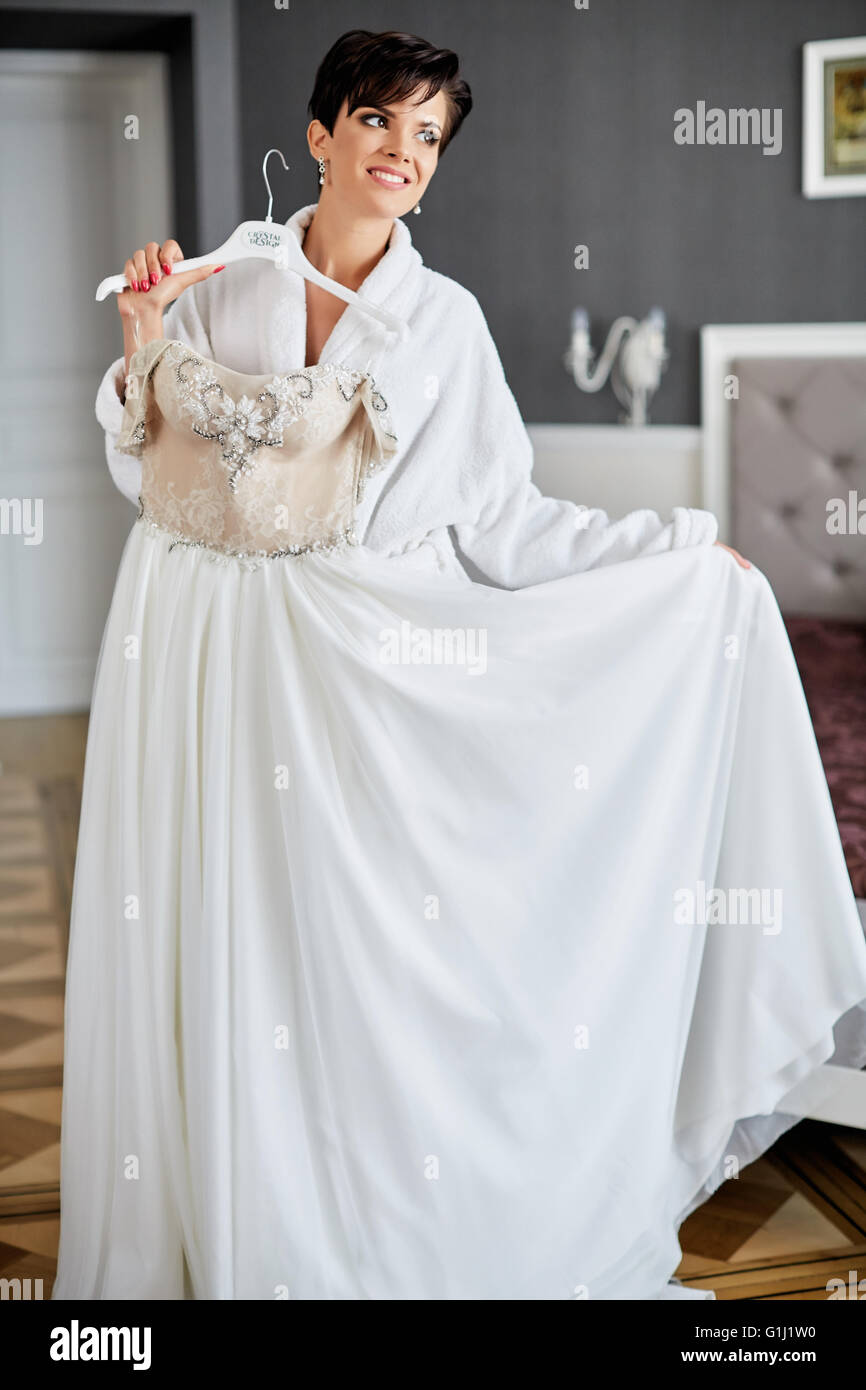 young beautiful woman dresses wedding dress morning bride Stock Photo Alamy