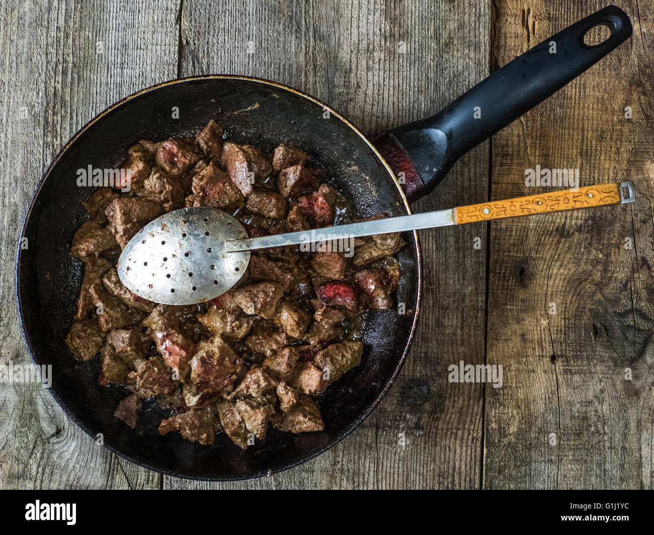 Fried liver in a frying pan Stock Photo