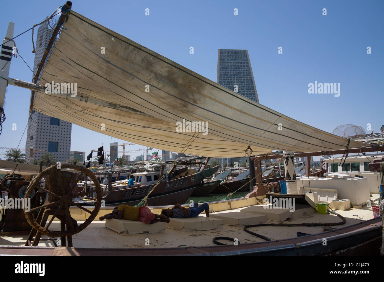 Taking shade form the heat and strong sun whilst in harbour. Stock Photo