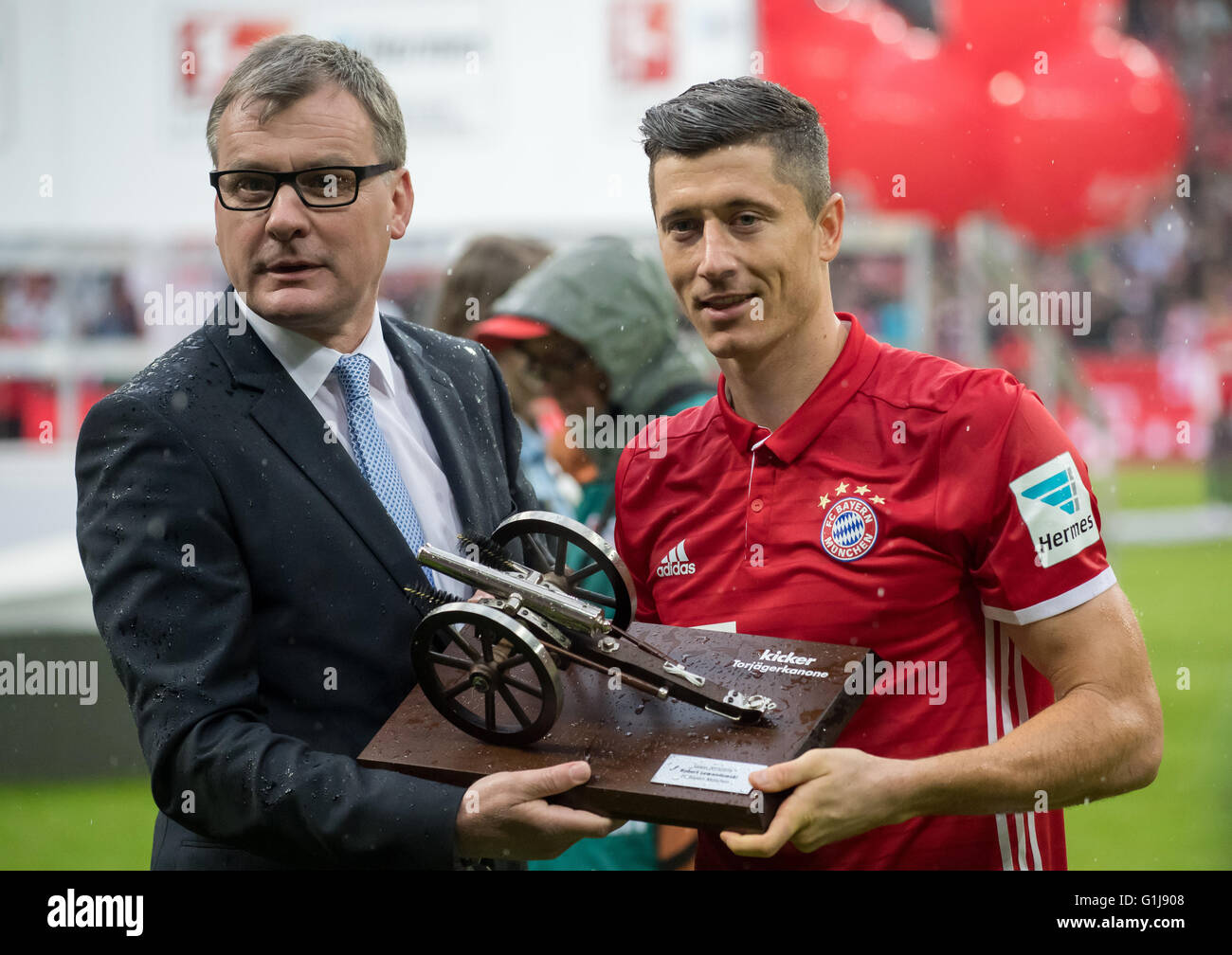 Munich's Robert Lewandowski receiving the Torjaegerkanone (lt. The top scorers canon) awarded to the highest scorer of the past season after the German Bundesliga between FC Bayern Munich and Hanover