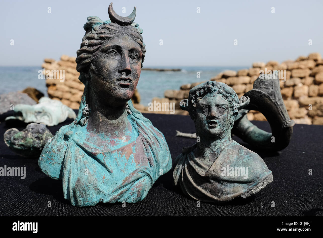 Caesarea, Israel. 16th May, 2016. Figurines of the moon goddess Luna (left) and Dionysus (right), the god of wine. An underwater salvage survey conducted in recent weeks at the ancient Caesarea Harbor by divers from the Israel Antiquities Authority has led to the exposure of a “large, spectacular and beautiful, ancient marine cargo” of a merchant ship that sank during the Late Roman period. Credit:  Nir Alon/Alamy Live News Stock Photo