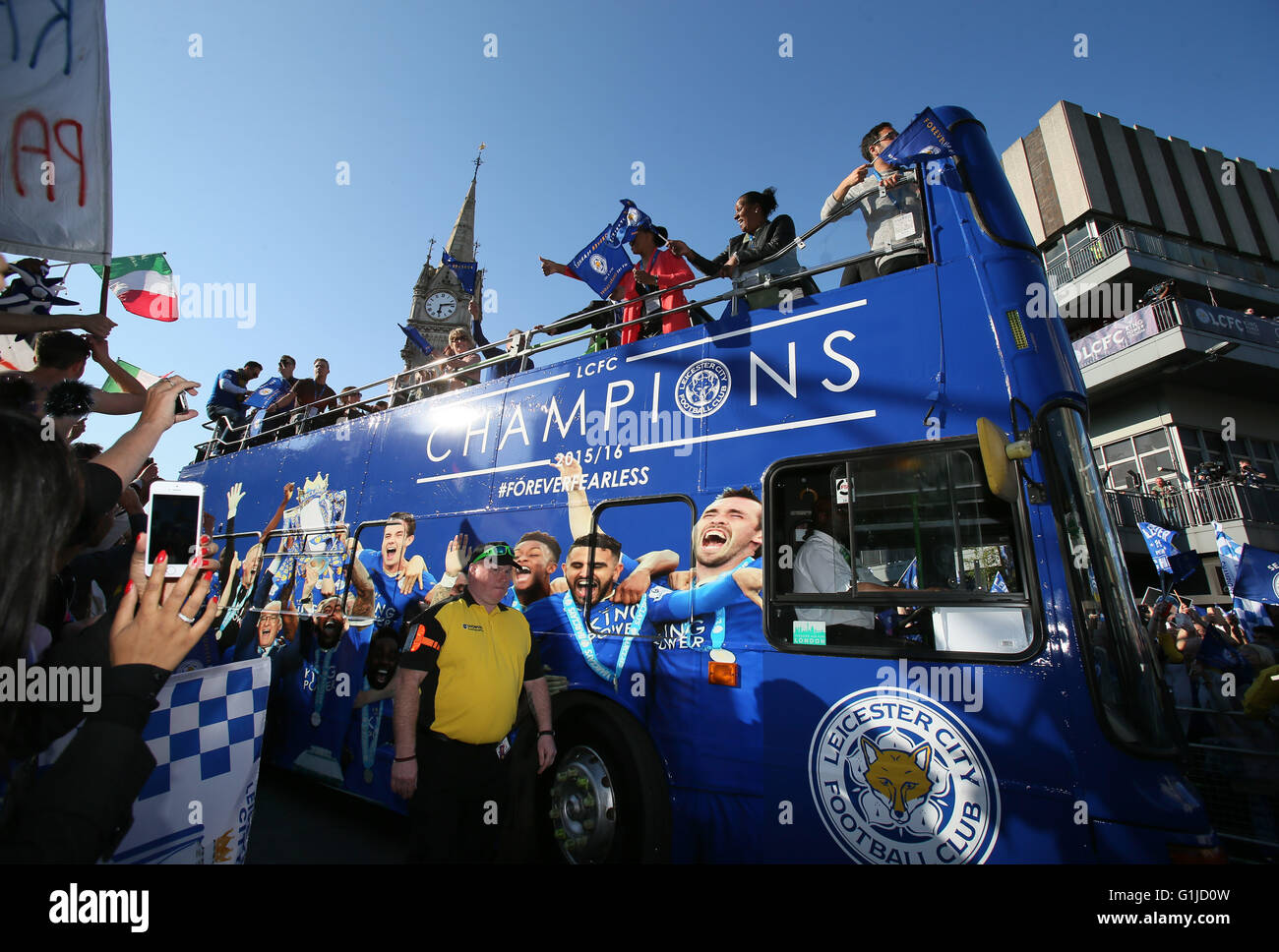 Leicester, UK. 16th May, 2016. Players and managers of Leicester City FC greet fans during the Leicester City's Barclays Premier League victory bus parade in Leicester, England, on May 16, 2016. Credit:  Han Yan/Xinhua/Alamy Live News Stock Photo