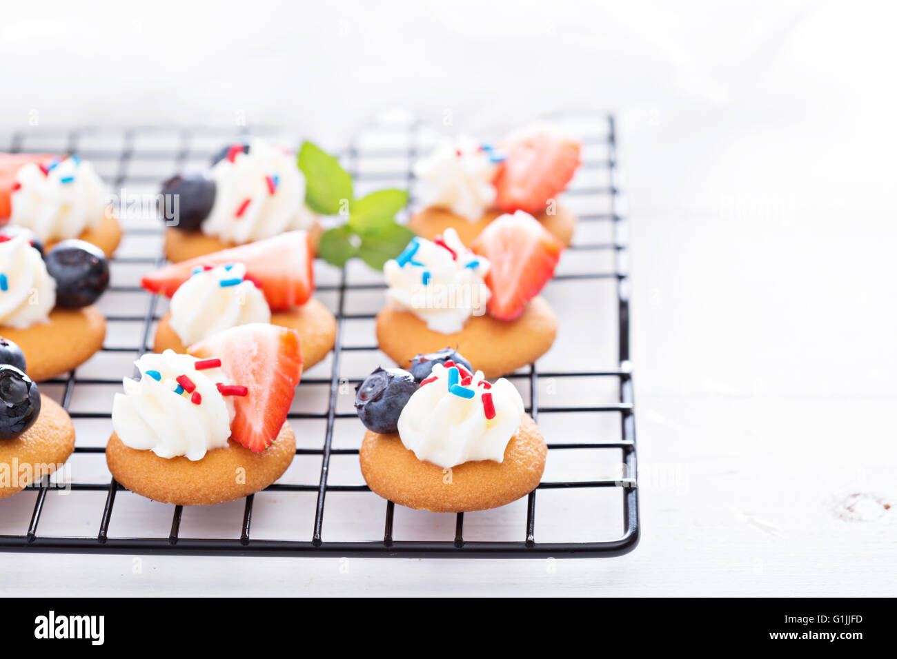 Little desserts with whipped cream and berries Stock Photo Alamy