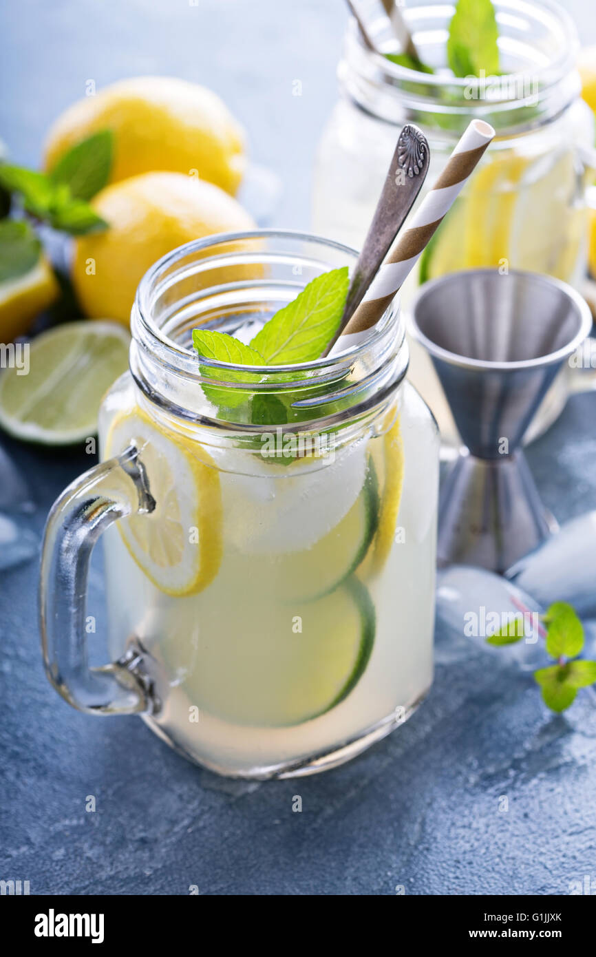 Spiked citrus lemonade in mason jars Stock Photo