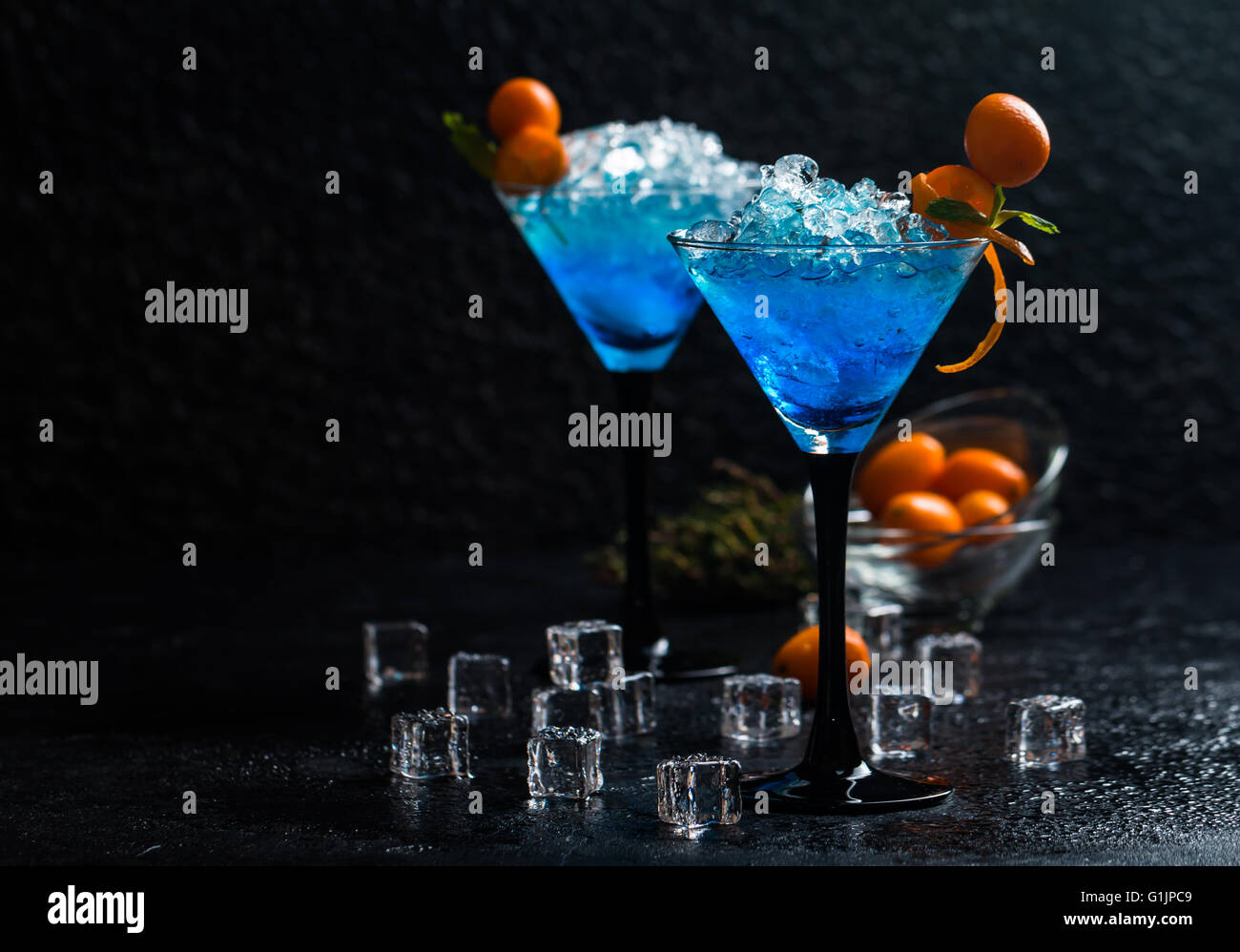 Blue cocktail in martini glasses Stock Photo Alamy