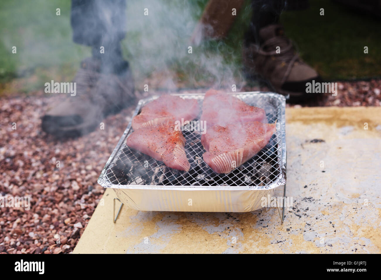 Tuna steaks grilling on a barbecue outside Stock Photo Alamy