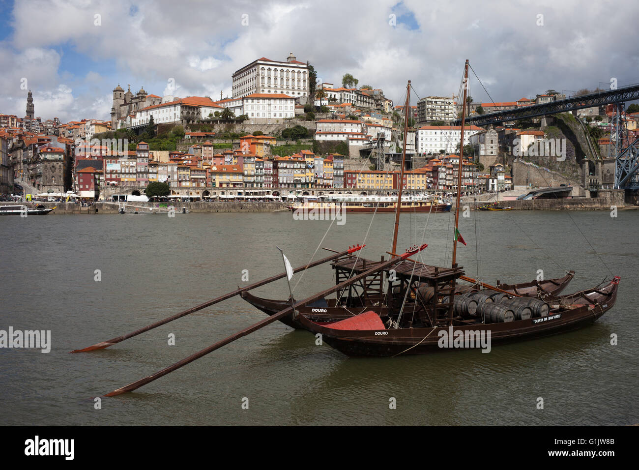 City of Porto in Portugal, Old Town skyline, Rabelo traditional Portuguese cargo boats with port wine barrels on Douro river, hi Stock Photo