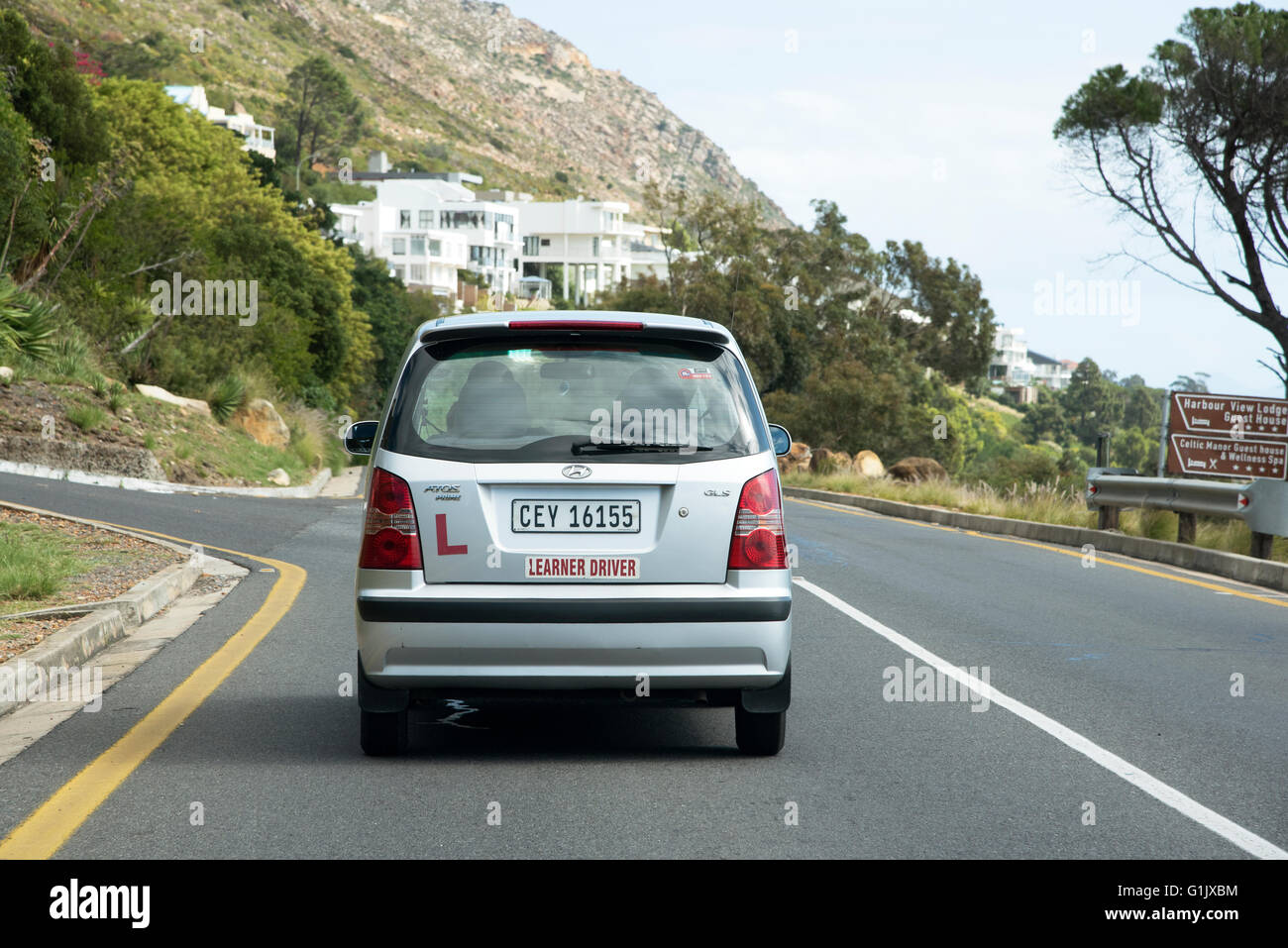 Learner car driver under instruction on a Gordon's Bay street. Western Cape South Africa Stock Photo