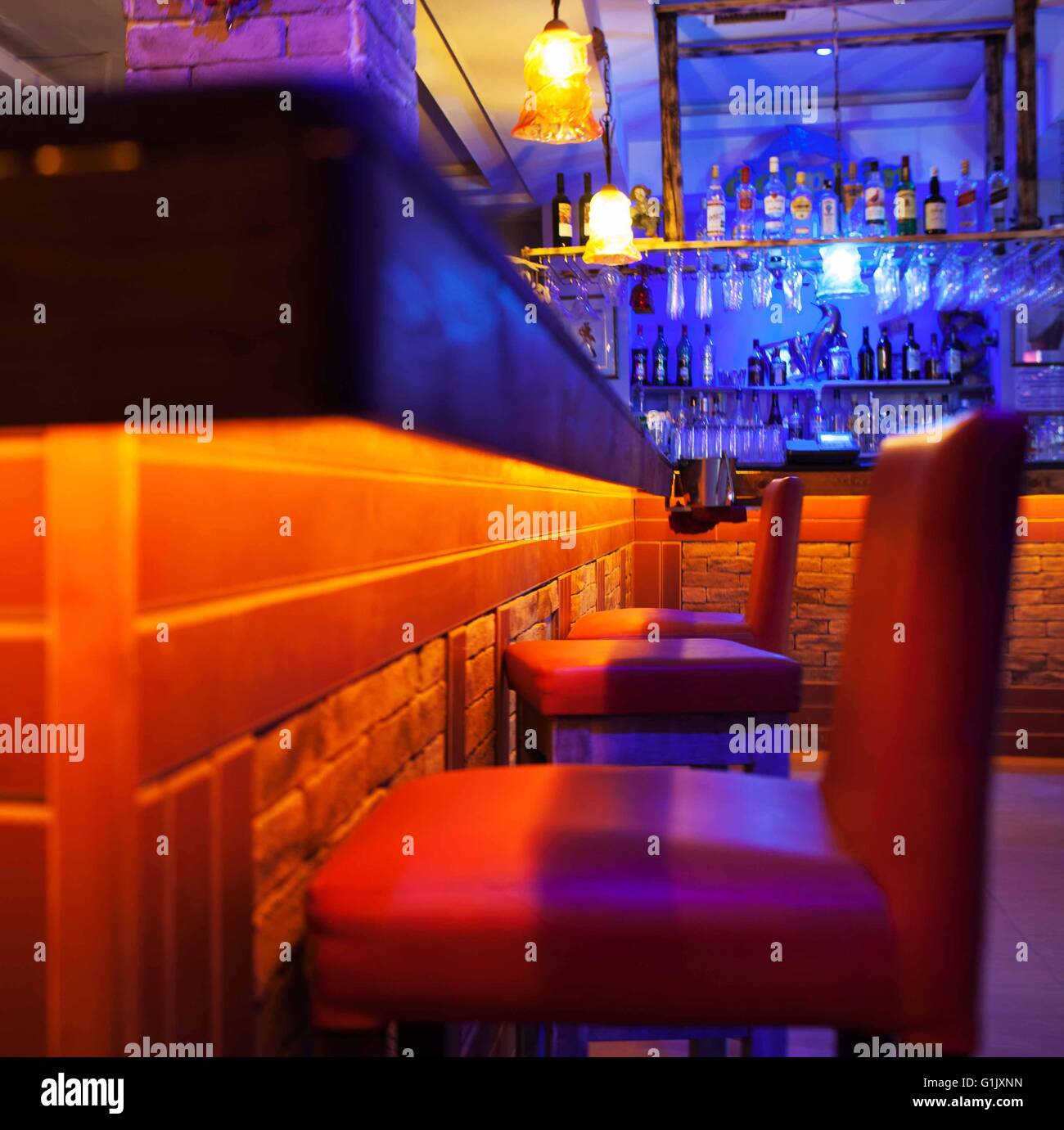 Seats in a brightly lit cocktail bar or nightclub Stock Photo - Alamy