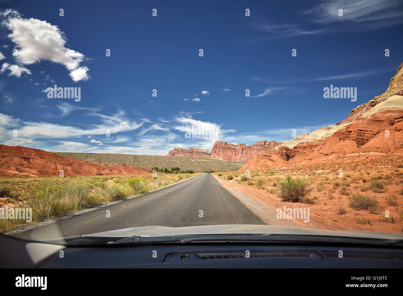 Photo of a road taken from the front seat of a car, travel concept, USA. Stock Photo