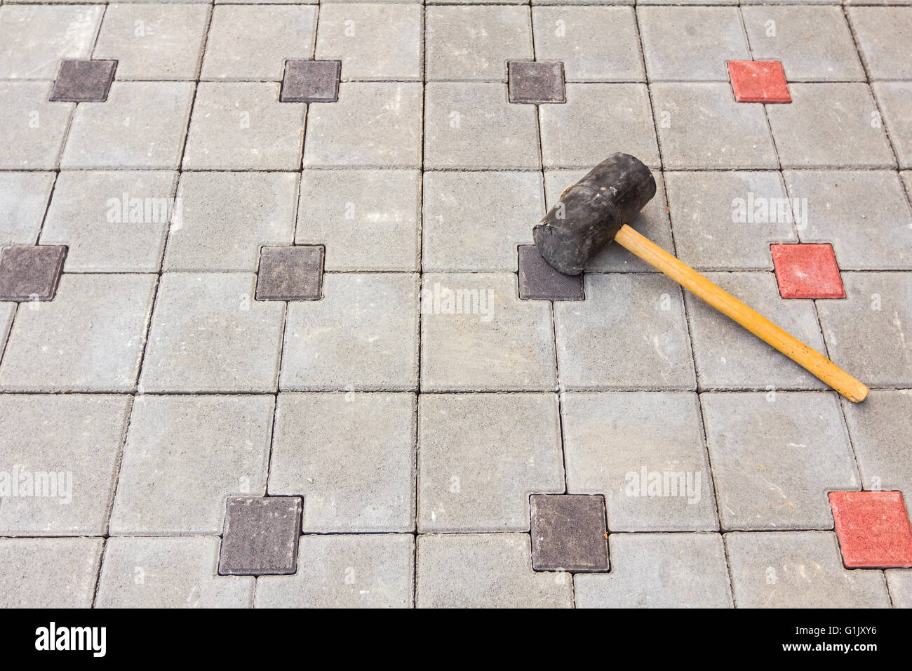 Mason tool for curb stone and brick pavement laying down rubber