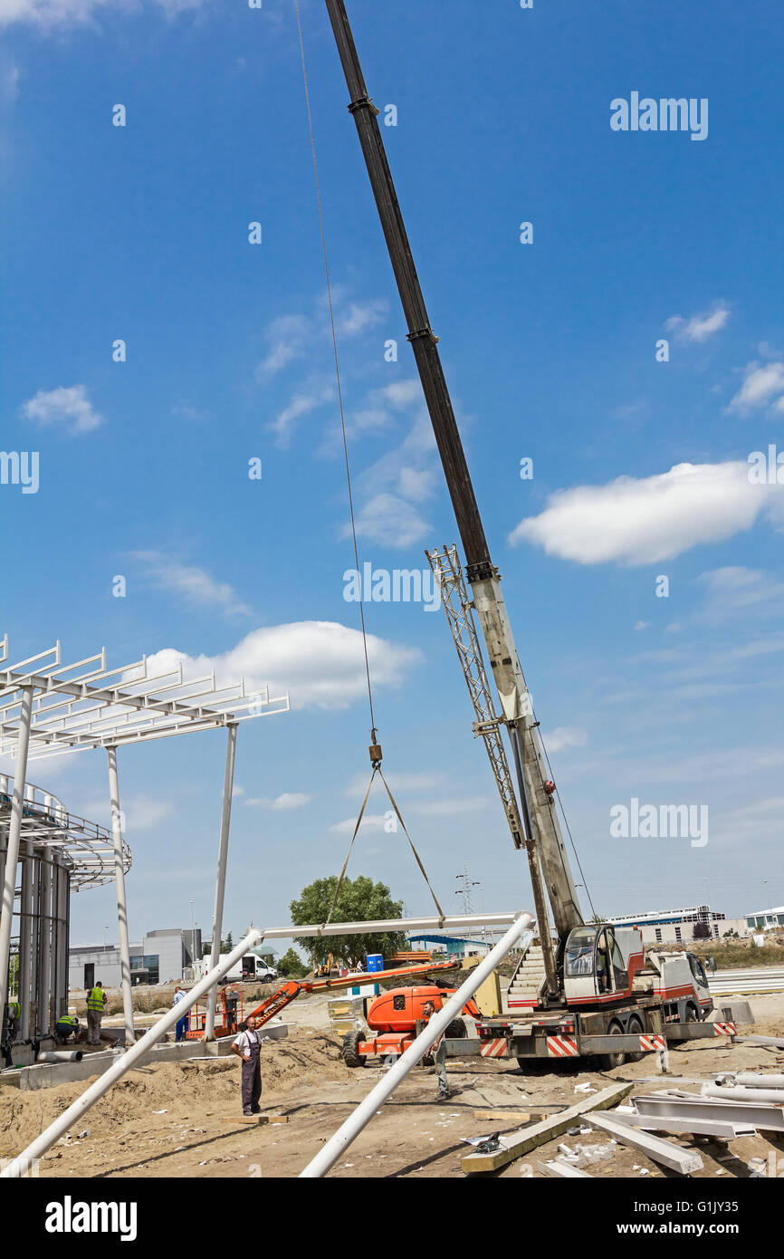 Mobile crane lifting steel frame hires stock photography and images