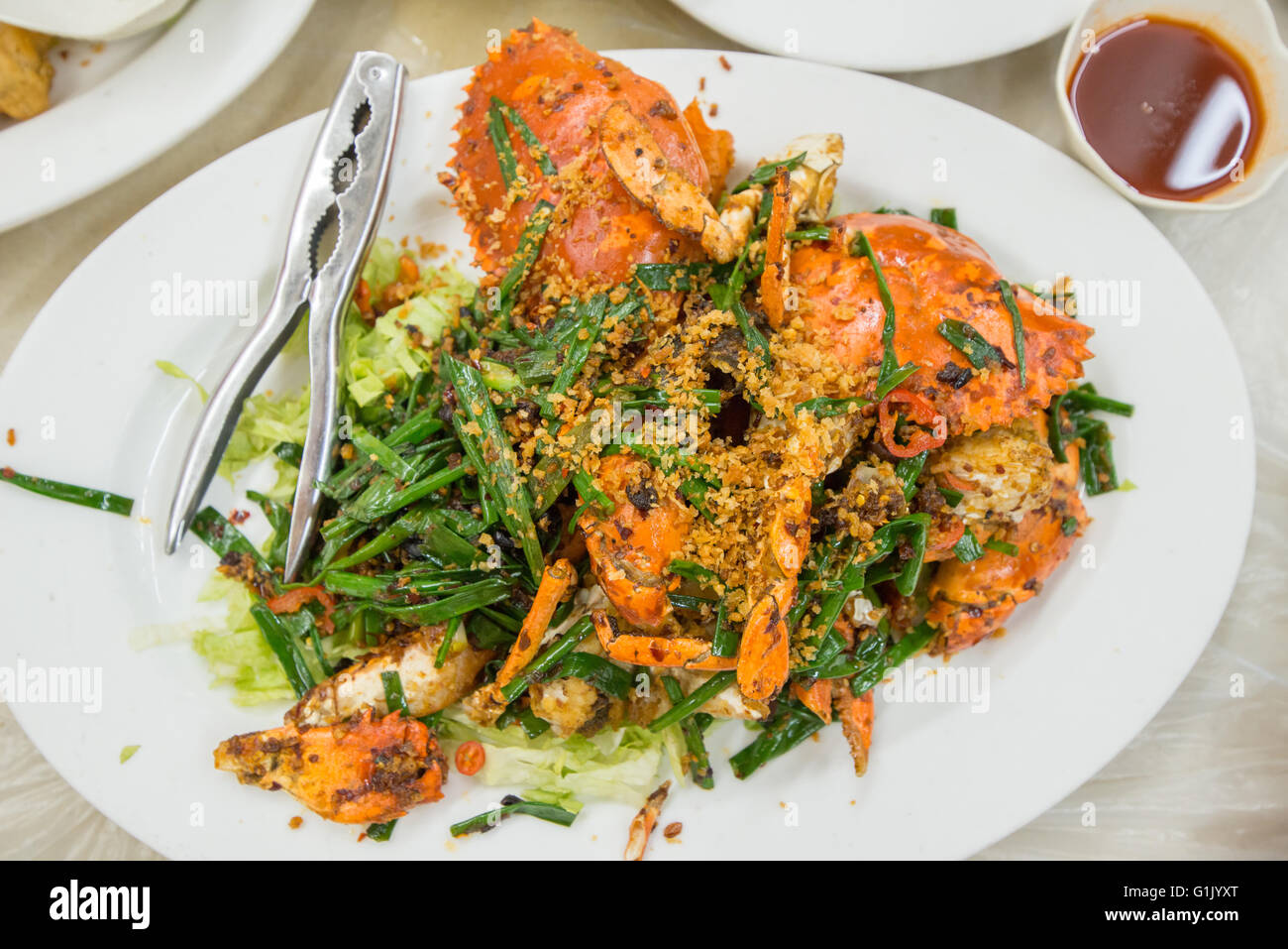 Cooked Asian styled crab recipe on a plate Stock Photo