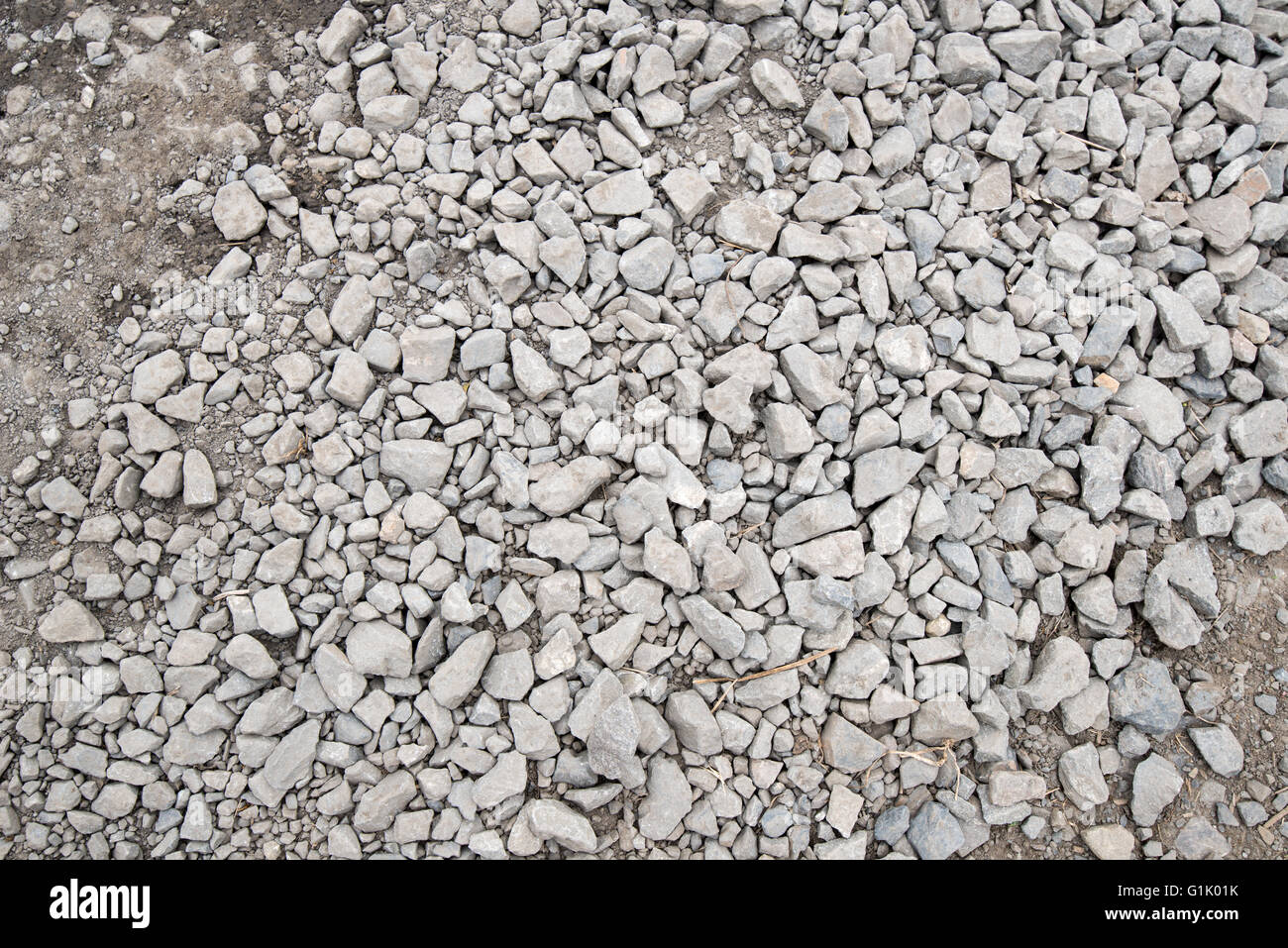 Small dusty rocks on dirt road Stock Photo