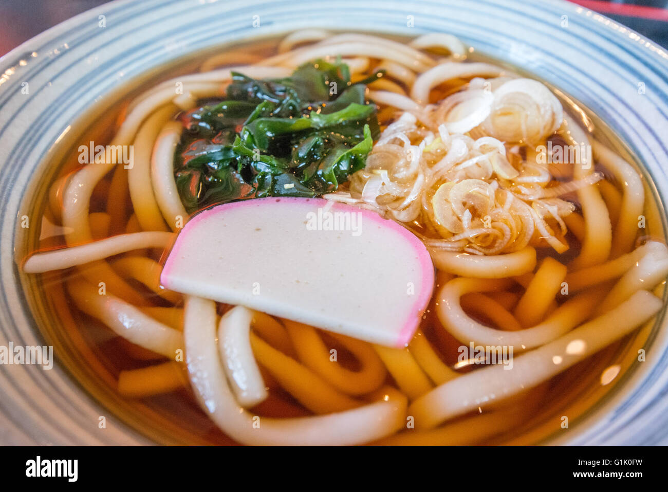 Udon Japanese noodle soup in a bowl Stock Photo