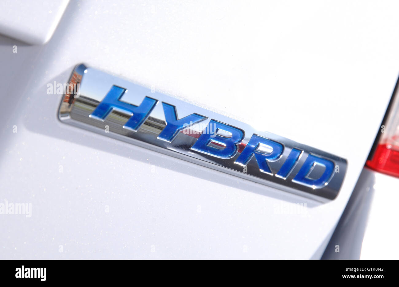 Hybrid badge on a 2009 Honda Insight hybrid family hatchback car Stock Photo