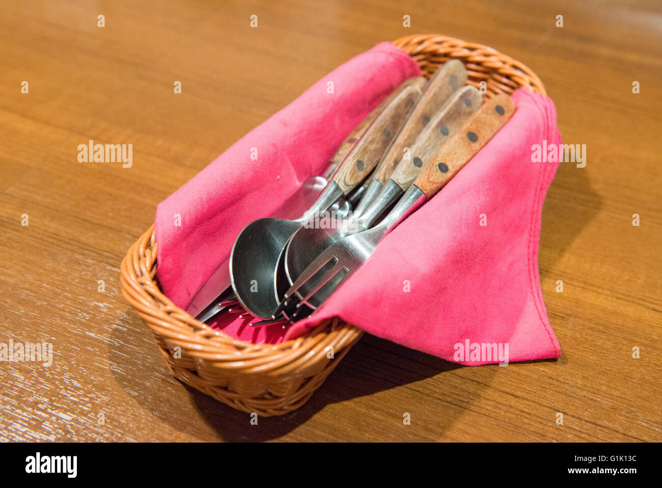 Cutlery in basket Stock Photo Alamy