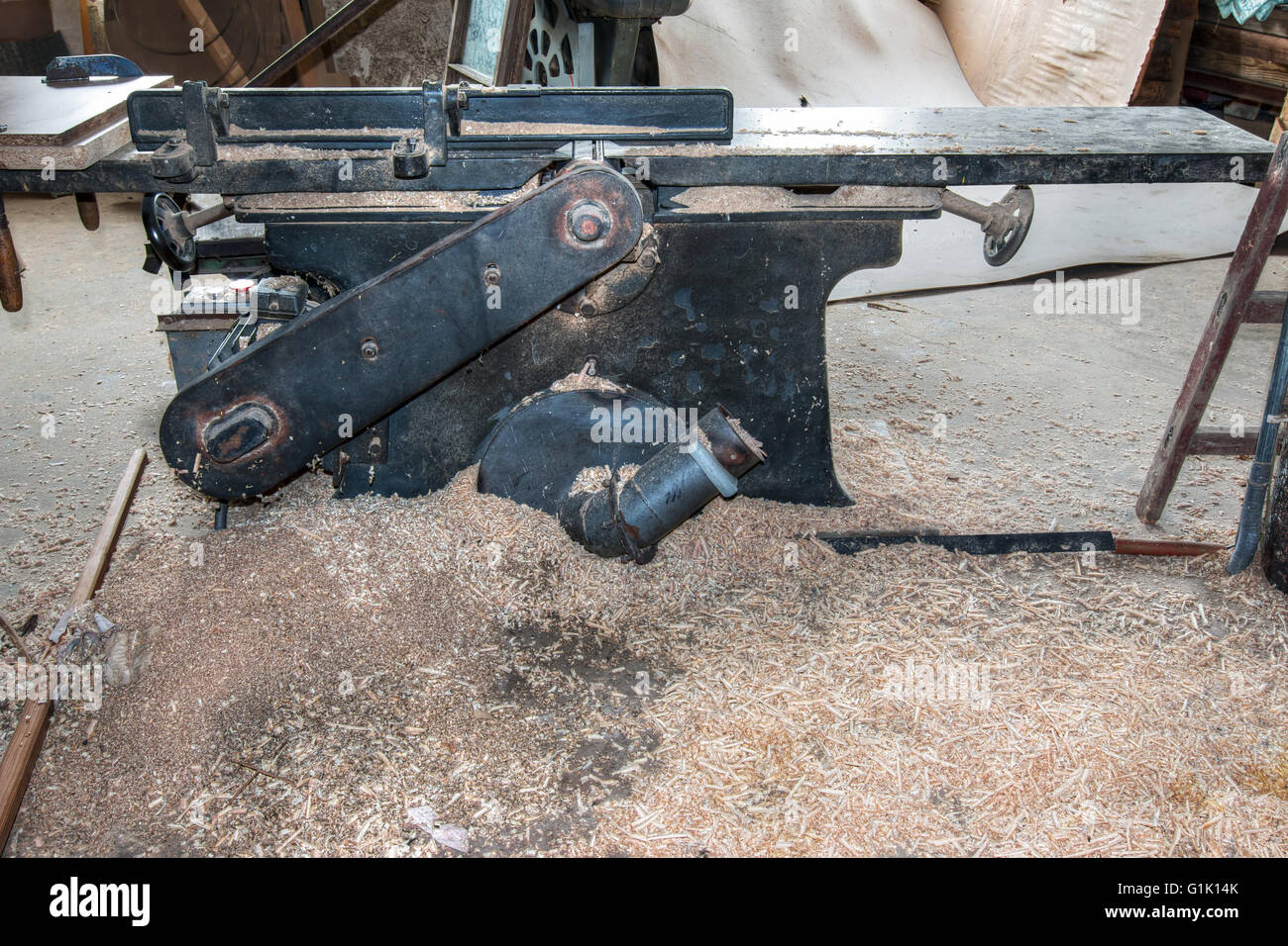 Old and used planing machine in the joinery workshop Stock Photo