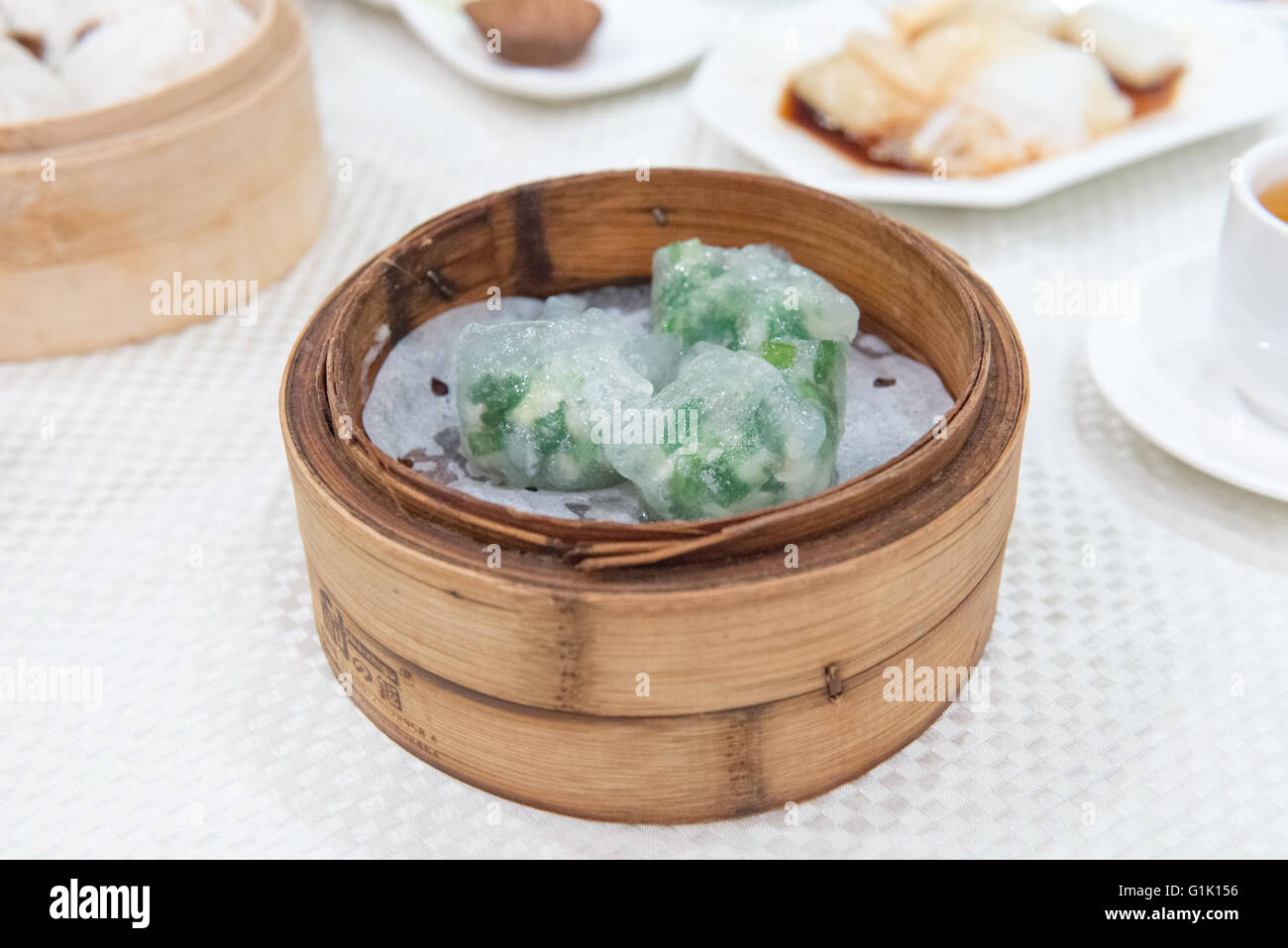 Rice floured covered meat and vegetables in bamboo basket at dim sum Stock Photo
