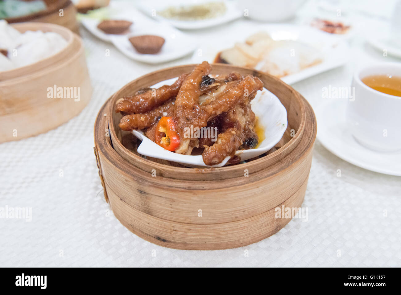 Seafood in curry sauce in bamboo basket at dim sum Stock Photo