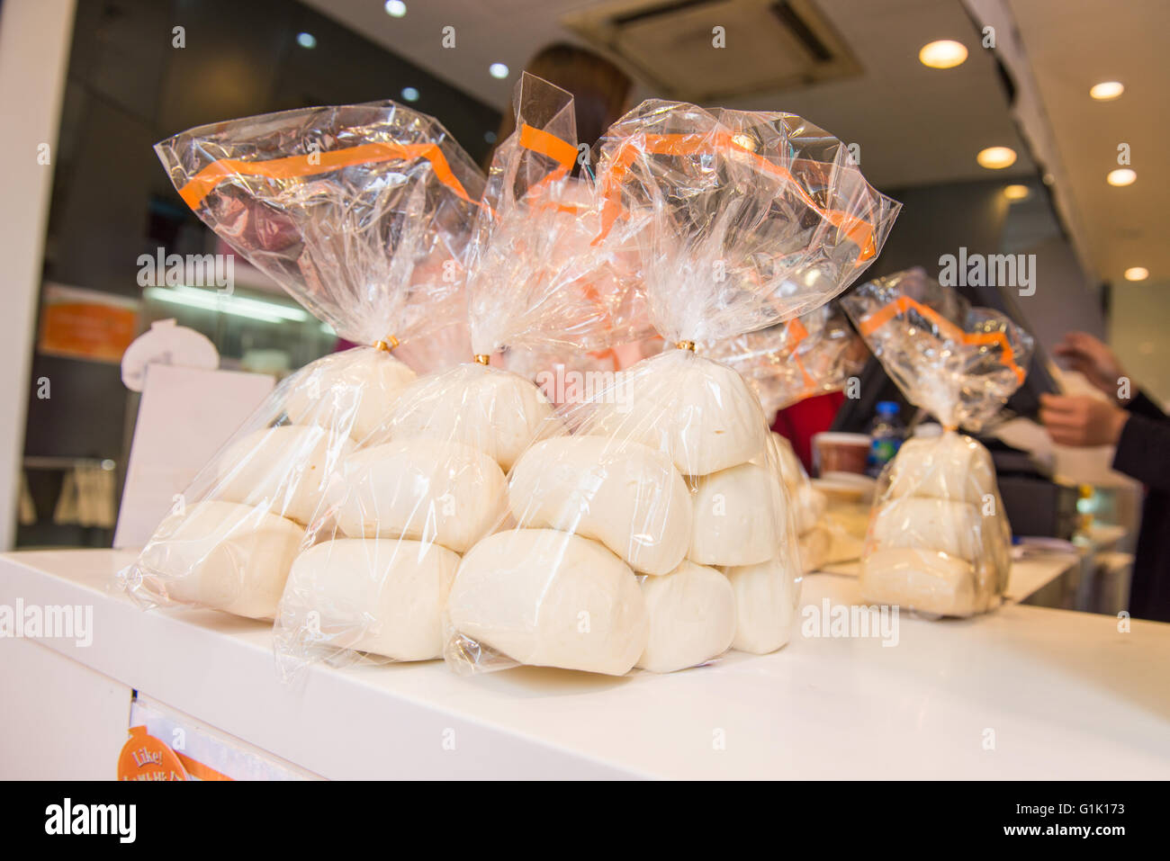 Soft bread rolls in a plastic bag in shop Stock Photo