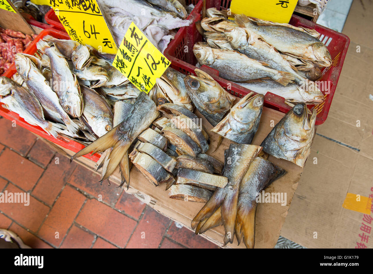 A selection of dry and cut fish outside at market Stock Photo