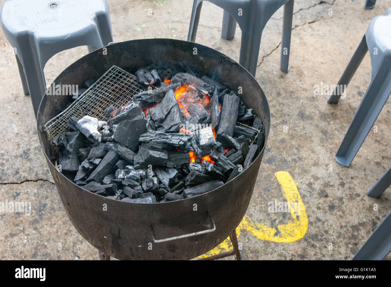 Outside Charcoal fire for cooking at a barbecue Stock Photo