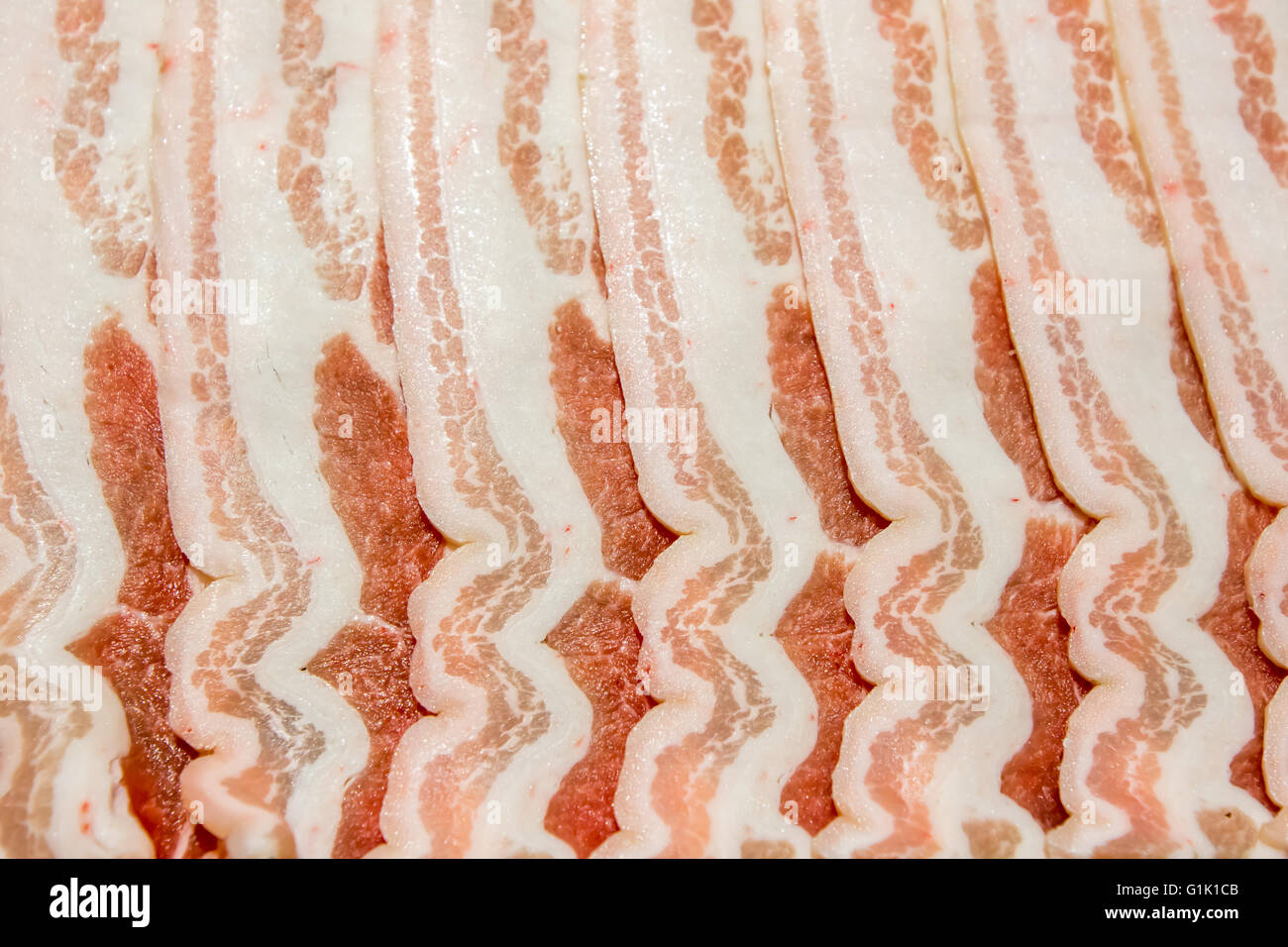 slices of pork bacon rashers laid against each other Stock Photo