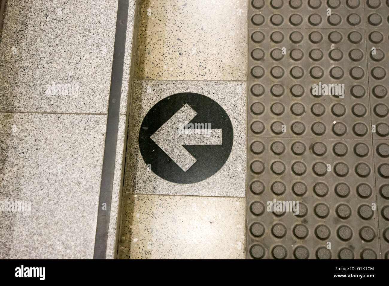 Printed arrow on floor direction to steps Stock Photo