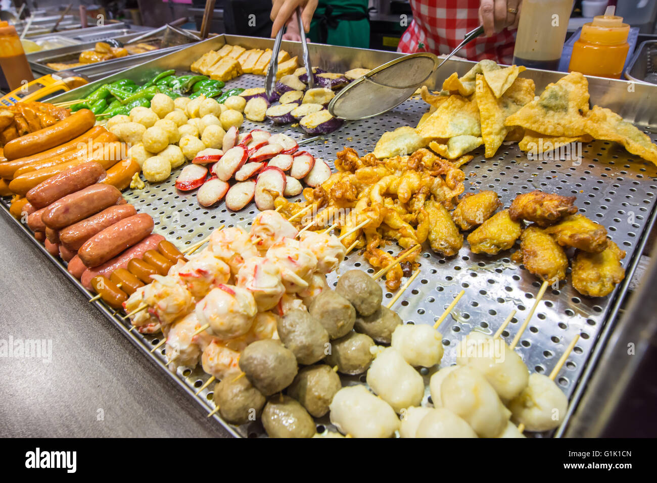 Mixed cooked Asian food at food stall Stock Photo