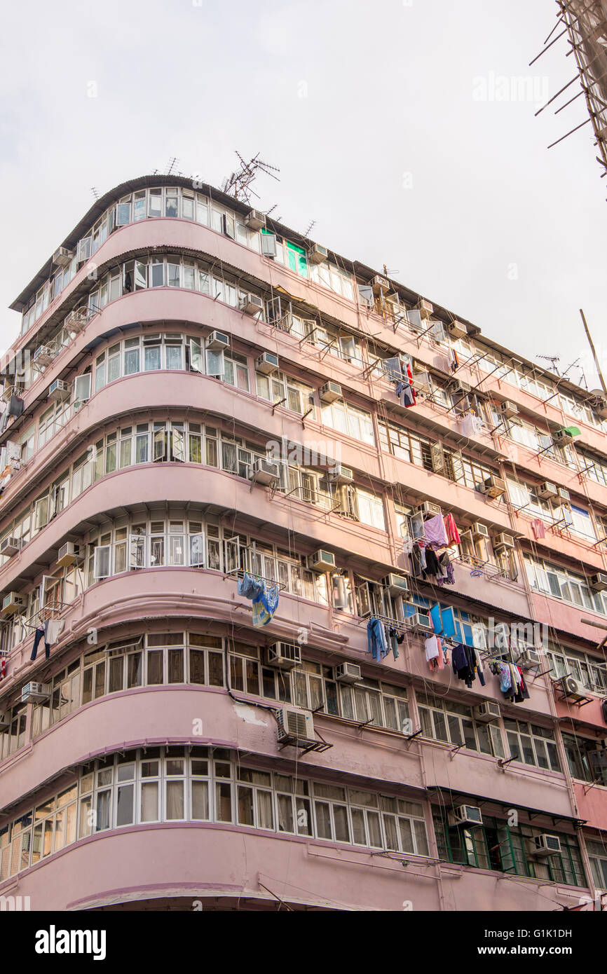 Corner building with condensed living in Hong Kong Stock Photo