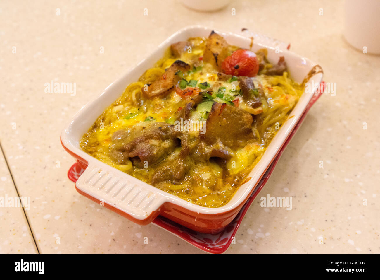 Baked beef and spaghetti in a cheese sauce Stock Photo