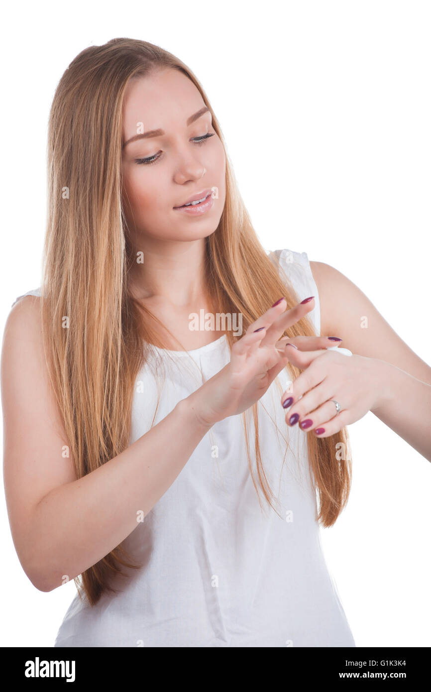 Woman applies cream on hands Stock Photo