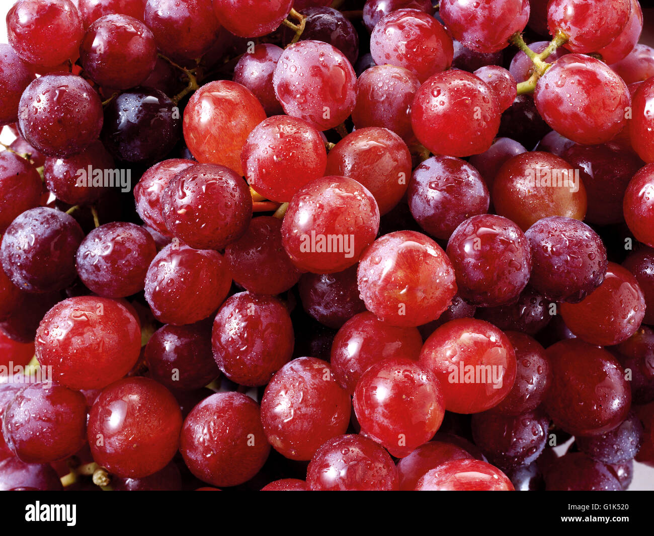 Close up of a bunch of fresh red grapes Stock Photo