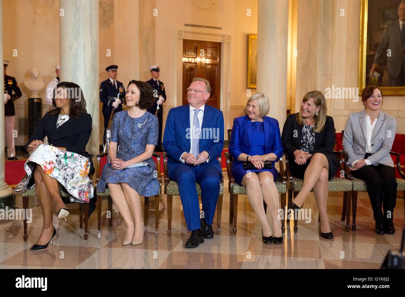 U.S First Lady Michelle Obama and the spouses of the Nordic leaders react to remarks by President Barack Obama during the arrival ceremony in the Grand Foyer of the White House May 13, 2016 in Washington, DC. Stock Photo