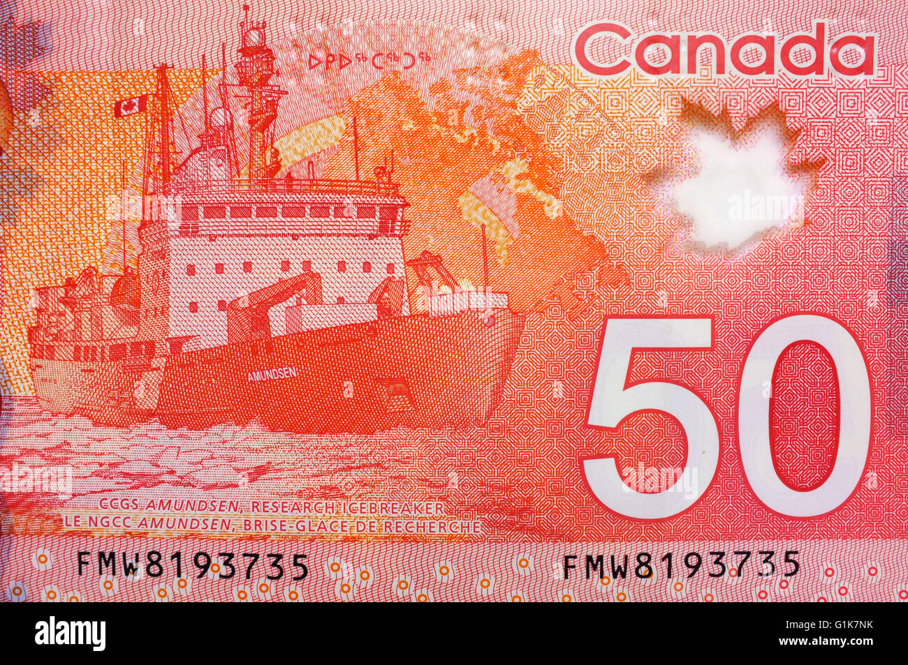 A close view of the back of a Canadian Fifty Dollar note photographed against a white background. Stock Photo