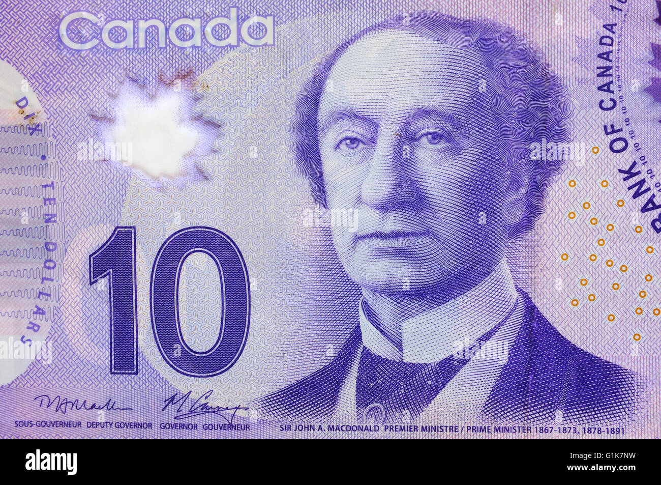 A close view of the front of a Canadian Ten Dollar note photographed against a white background. Stock Photo
