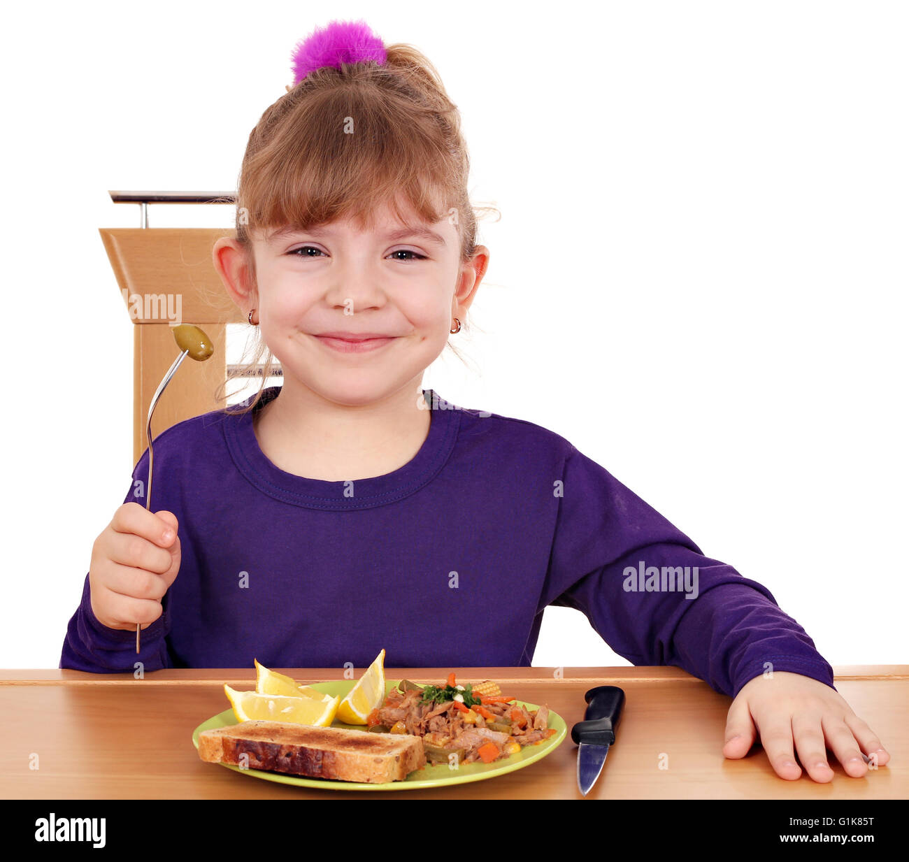 happy little girl eating Stock Photo Alamy